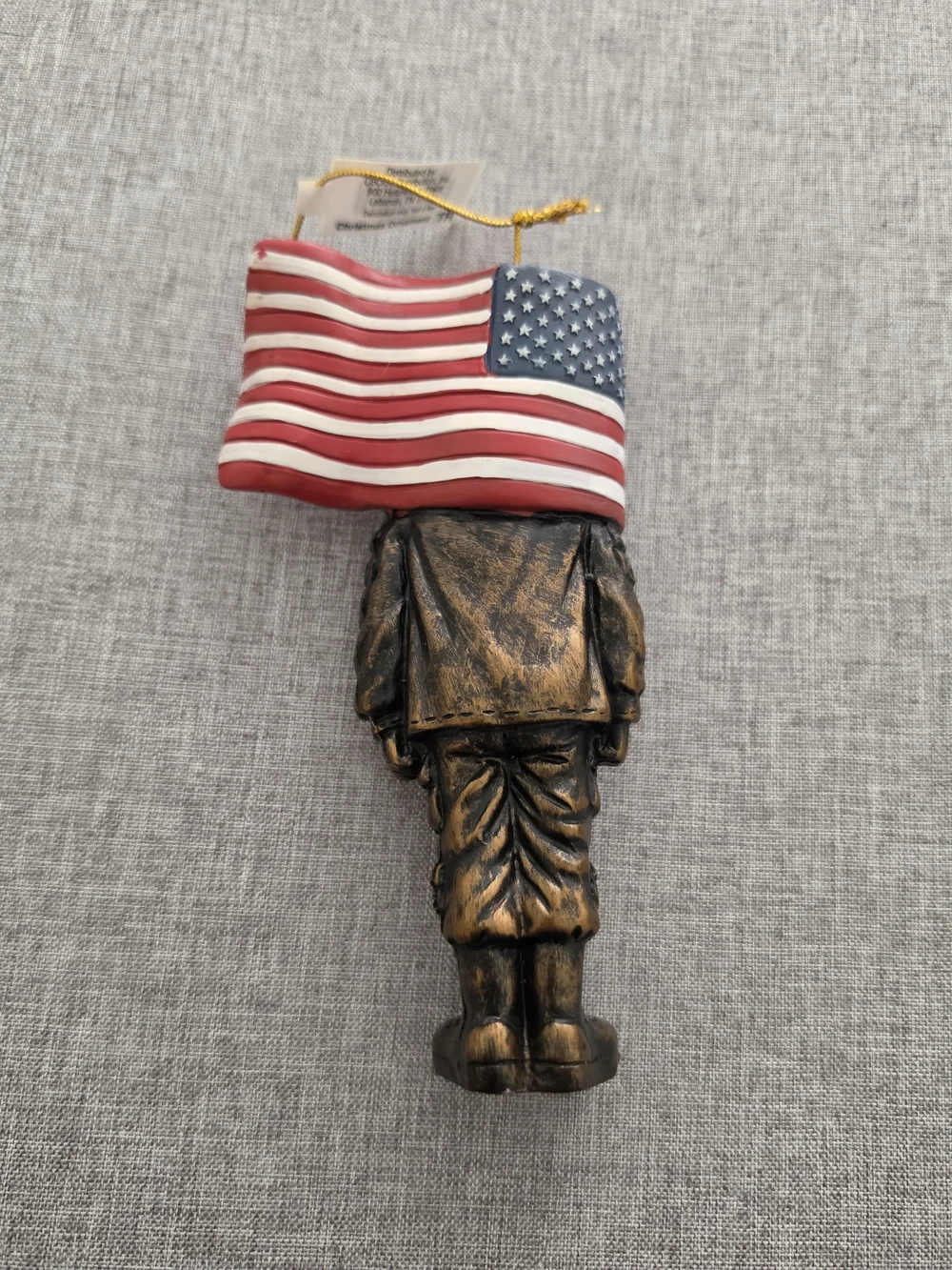 Cracker Barrel Bronze Soldier Ornament with Red, White & Blue Flag